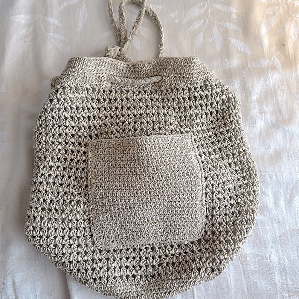 Woven bucket backpack purse.